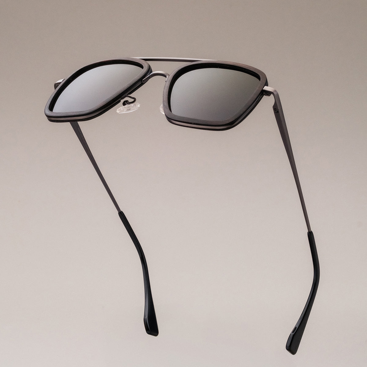 "The Logician" sunglasses featuring a sleek leadwood and antique silver design.