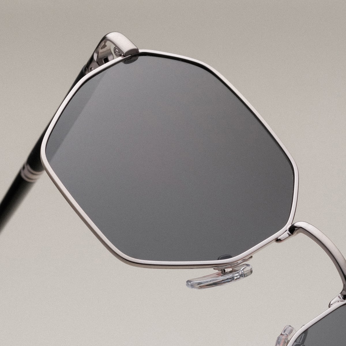 "The Magical" sunglasses featuring a sleek, geometric design with maple and antique silver accents.