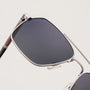 "The Professor" sunglasses feature a sleek walnut and antique silver design, combining elegance with modern style.