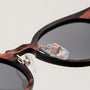 "The Maverick" sunglasses featuring a Padouk wood frame with copper accents for a stylish and sophisticated look.