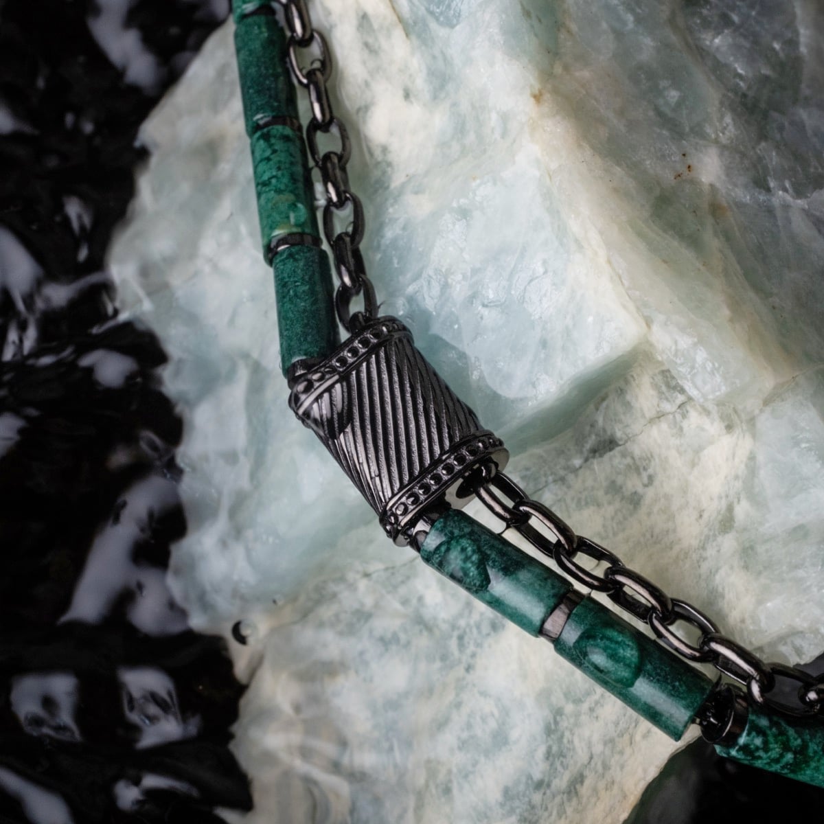 "Supersonic" necklace featuring aventurine and gray detailing with a stylish chain design.