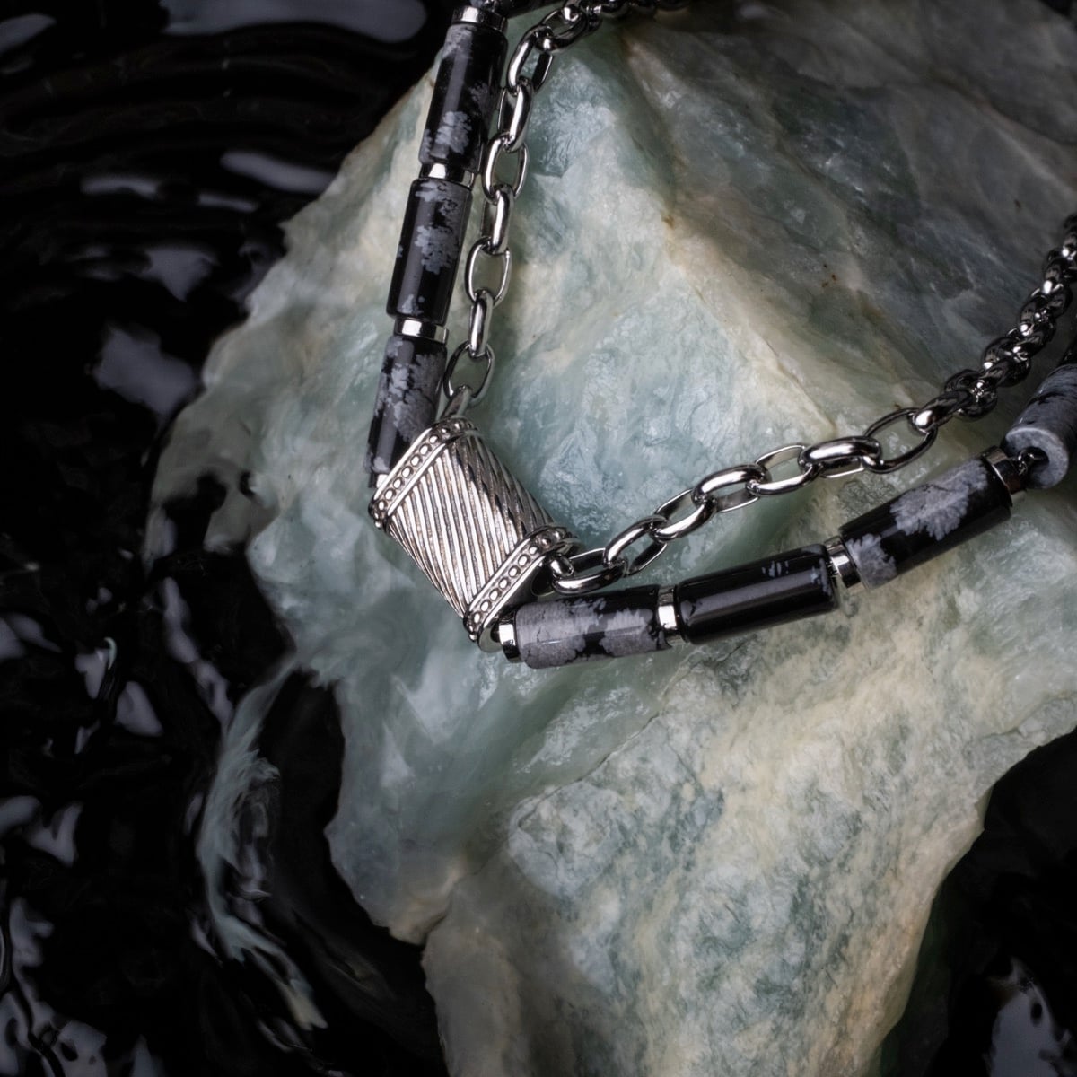 "Supersonic" necklace featuring obsidian and silver with a sleek, modern design.