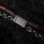 "Supersonic", a stylish bracelet featuring walnut and silver accents.