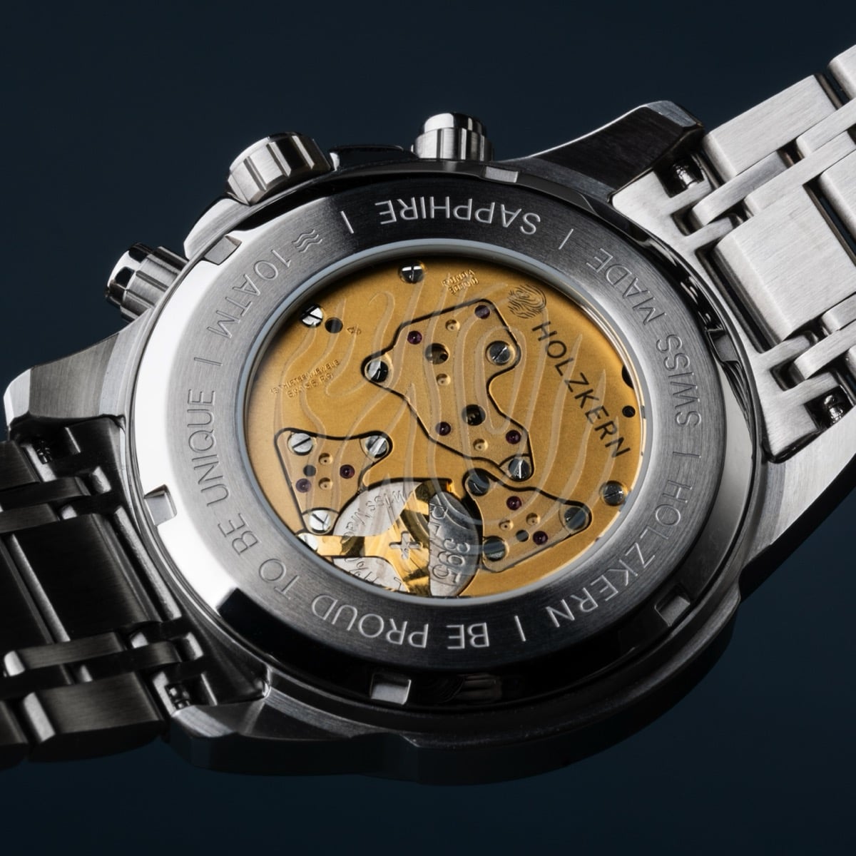 "Genevra" watch features a burl wood and walnut design with a sophisticated mechanical style.