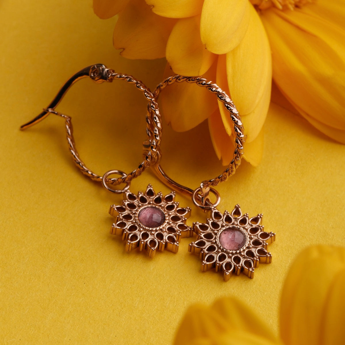 Suncatcher earrings, elegant earrings in rose gold with amethyst accents, featuring a radiant, floral-inspired design.