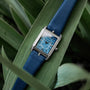 "Memoire" watch featuring a sleek blue agate design and rectangular dial with elegant details.