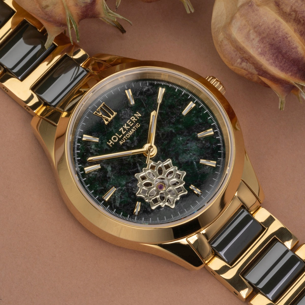 "Kaleidoscopic" watch with a jade and ceramic design featuring a kaleidoscopic visual style and gold accents.