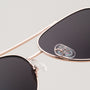 "The Badass I" sunglasses featuring a walnut and matte gold finish with a sleek, modern design.