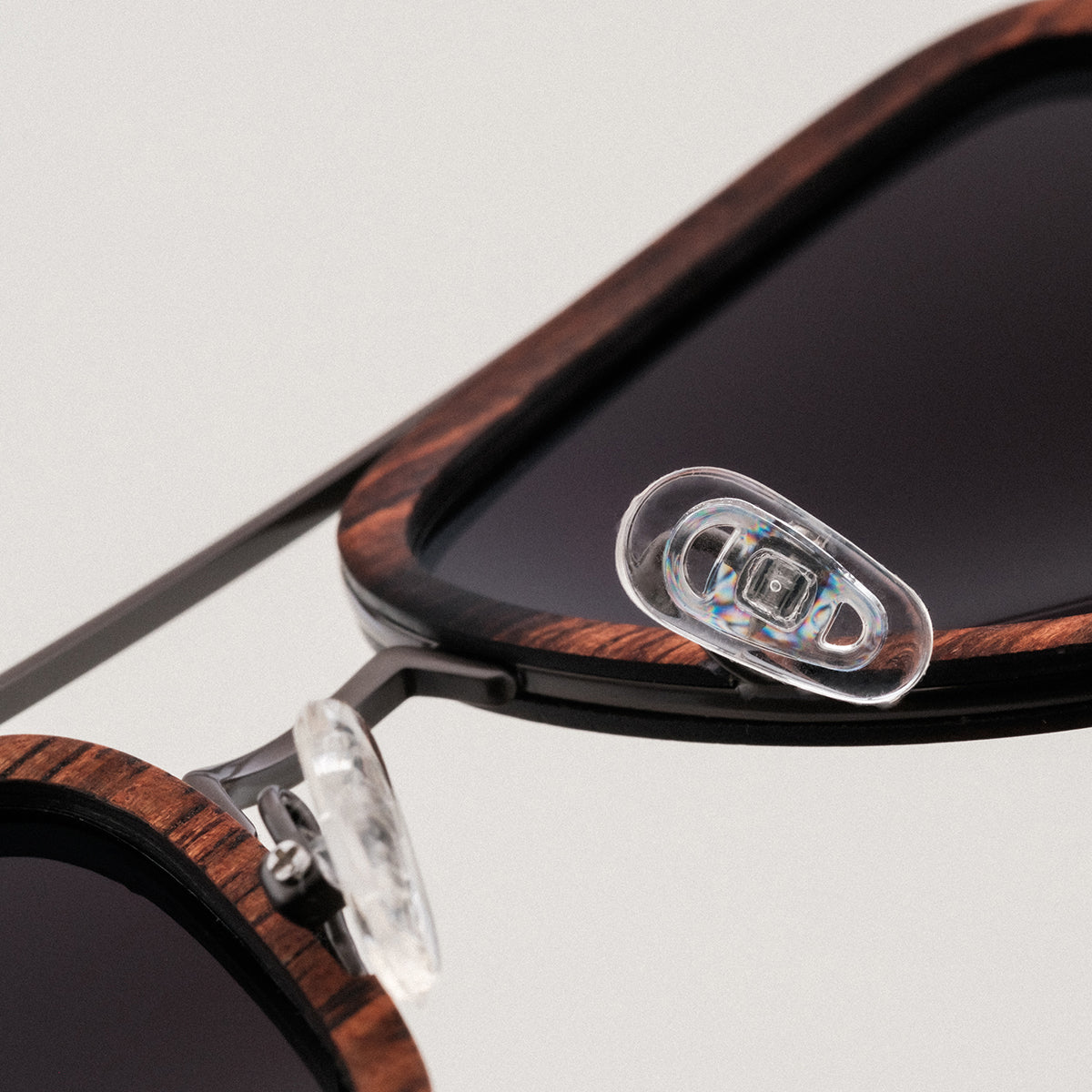 "The Logician", stylish sunglasses with a Leadwood and Antique Silver design, featuring a distinct and elegant look.