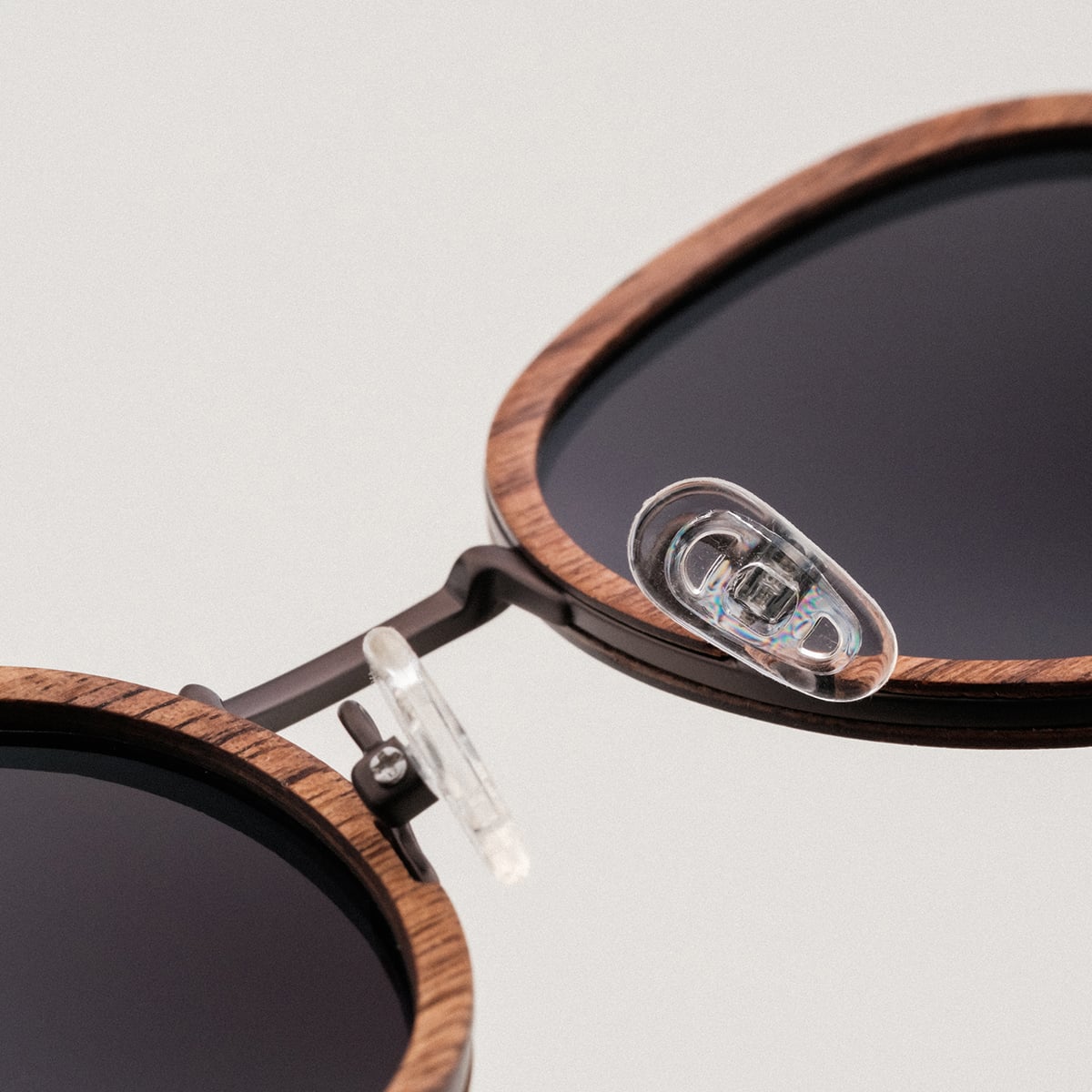 "The Radiant S" sunglasses featuring a sleek design with walnut and copper accents.