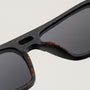 "The Triumphant" sunglasses feature a wooden frame in maple and slate tones for a stylish look.