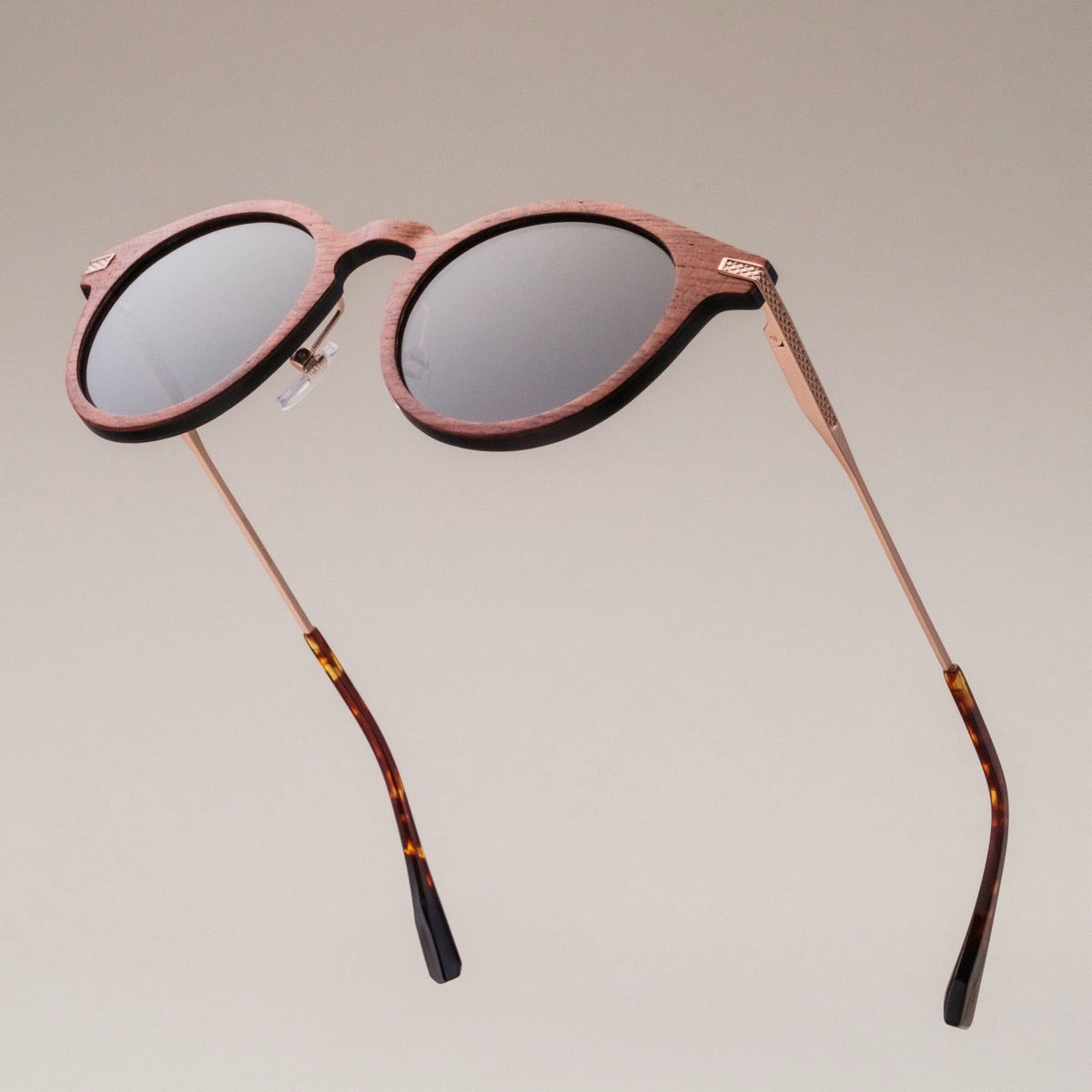 "The Maverick" sunglasses with a sleek padouk wood frame and copper accents for a modern, stylish look.