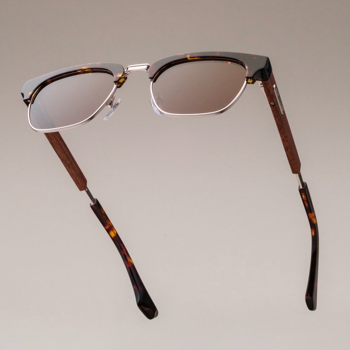 "The Virtuoso" sunglasses featuring a walnut and havana design with sleek style.