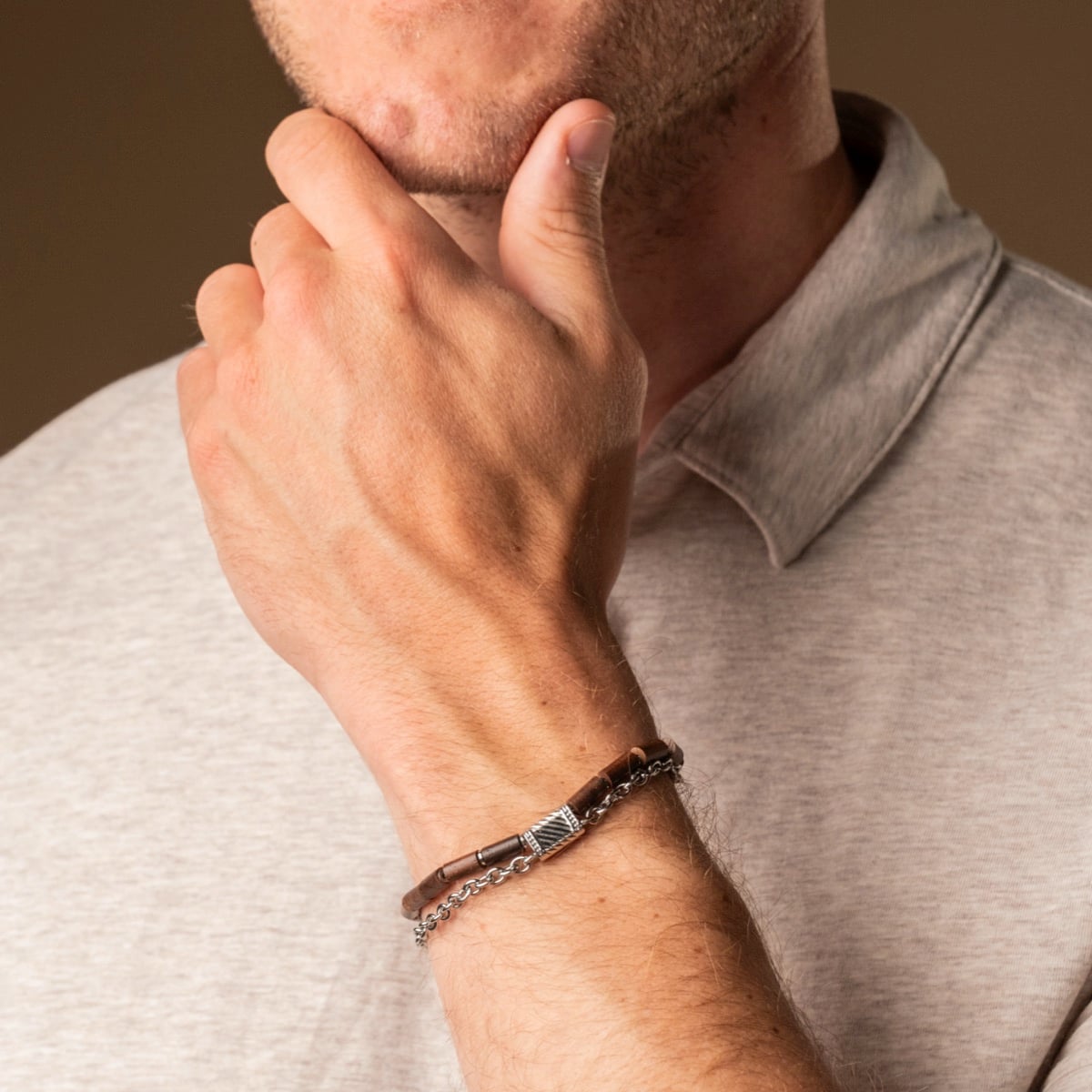 "Supersonic" bracelet featuring a walnut and silver design, showcasing a stylish and modern aesthetic.