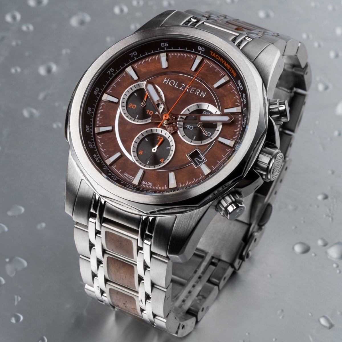 "Genevra" wristwatch with burl wood and walnut accents, featuring a sleek, modern design and stainless steel bracelet.