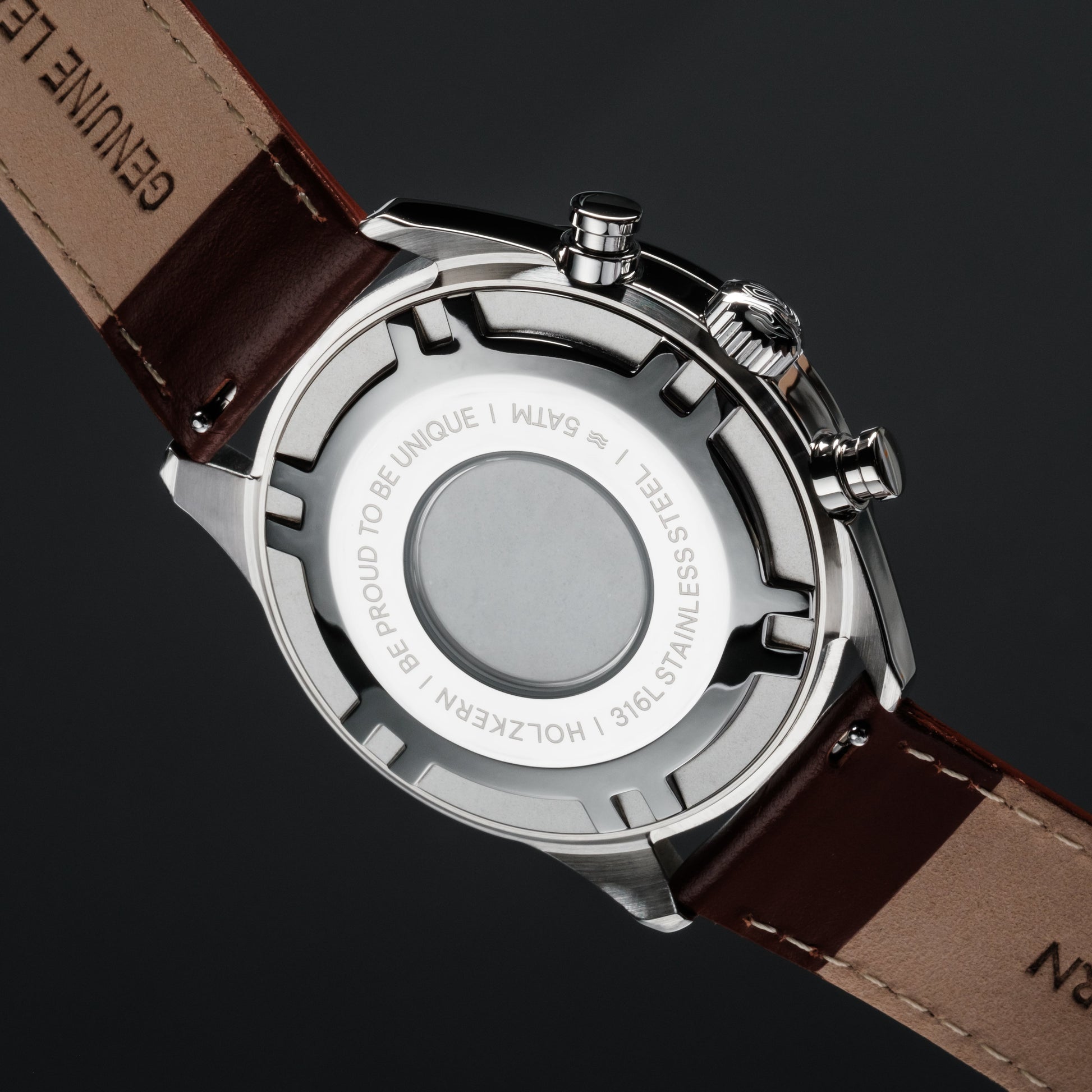 "Melodical watch featuring a marble and silver design with a genuine leather strap."