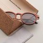 "The Maverick" sunglasses featuring a stylish mix of padouk wood and copper accents in a cork case.