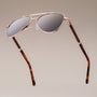 "The Badass I" sunglasses, featuring a sleek walnut and matte gold design.