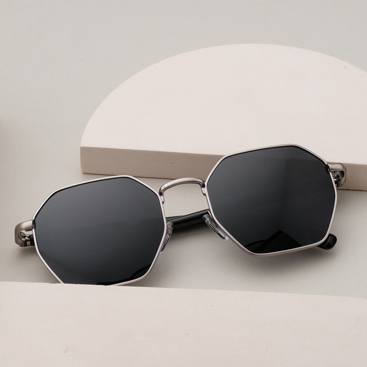 "The Magical" sunglasses in hexagonal shape featuring maple frames and antique silver accents.