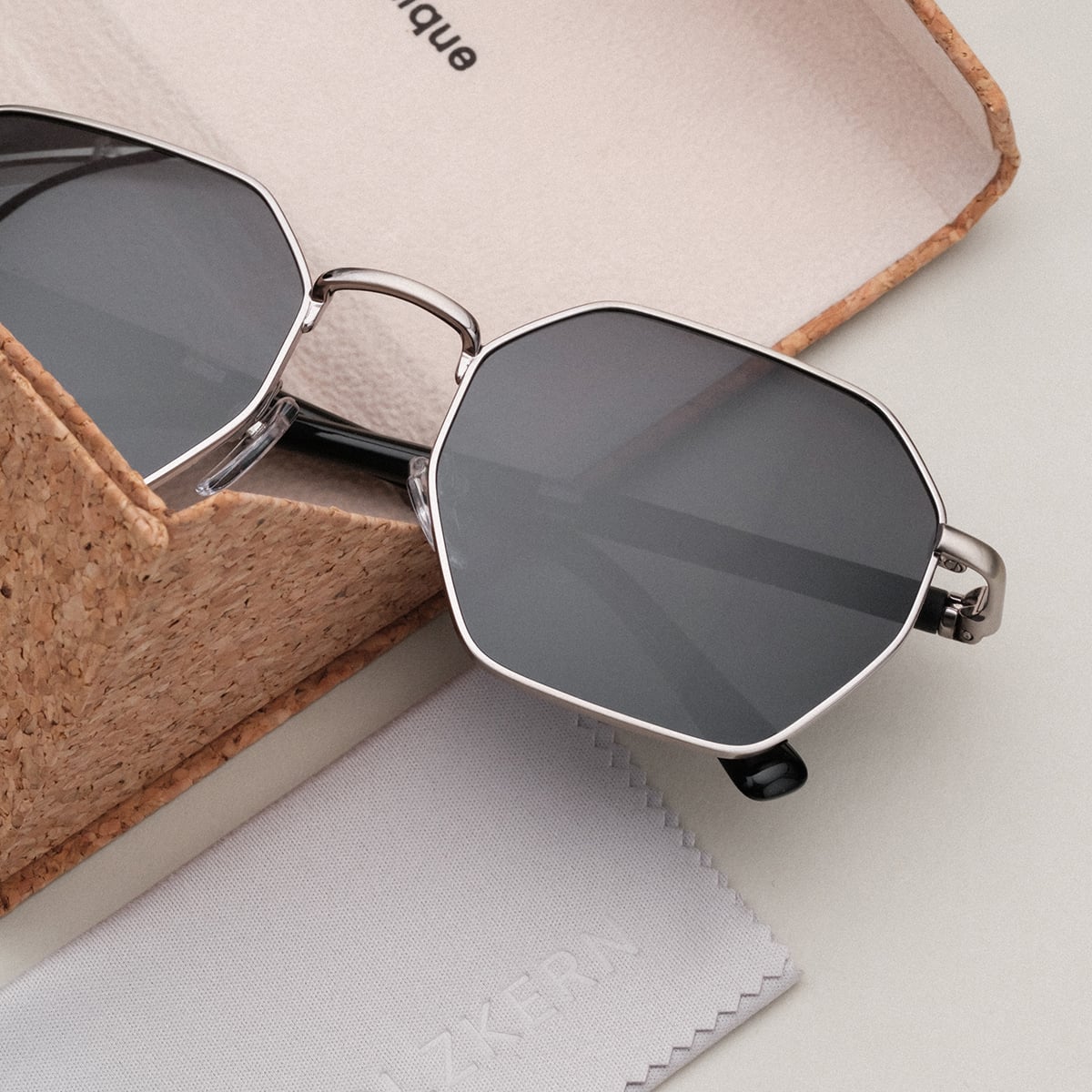 "The Magical" sunglasses in maple and antique silver with a modern, geometric design.