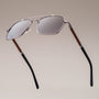 "The Professor" sunglasses, featuring a sleek walnut and antique silver design.