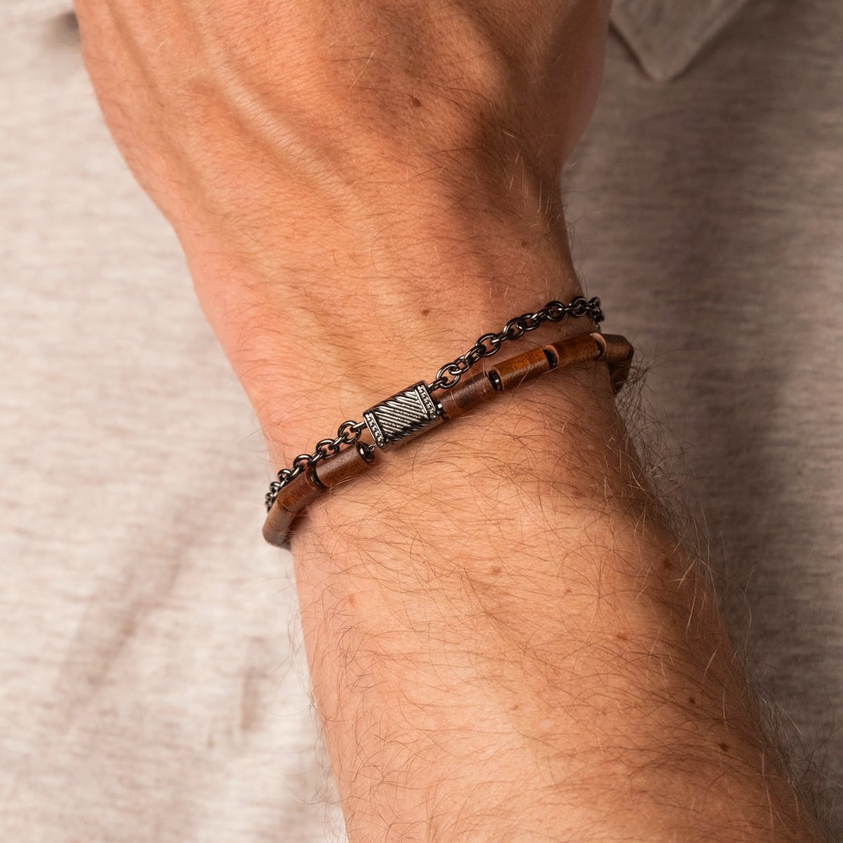 "Supersonic" bracelet featuring Koa wood and gray accents, worn on a wrist.