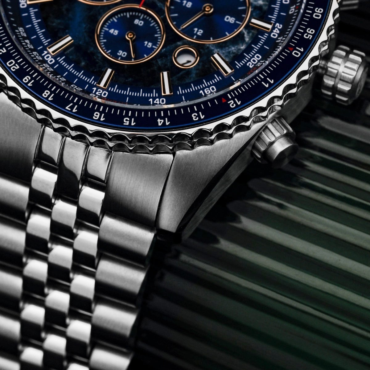 "Openhorizon" watch featuring a blue marble dial and silver stainless steel bracelet with intricate detailing.