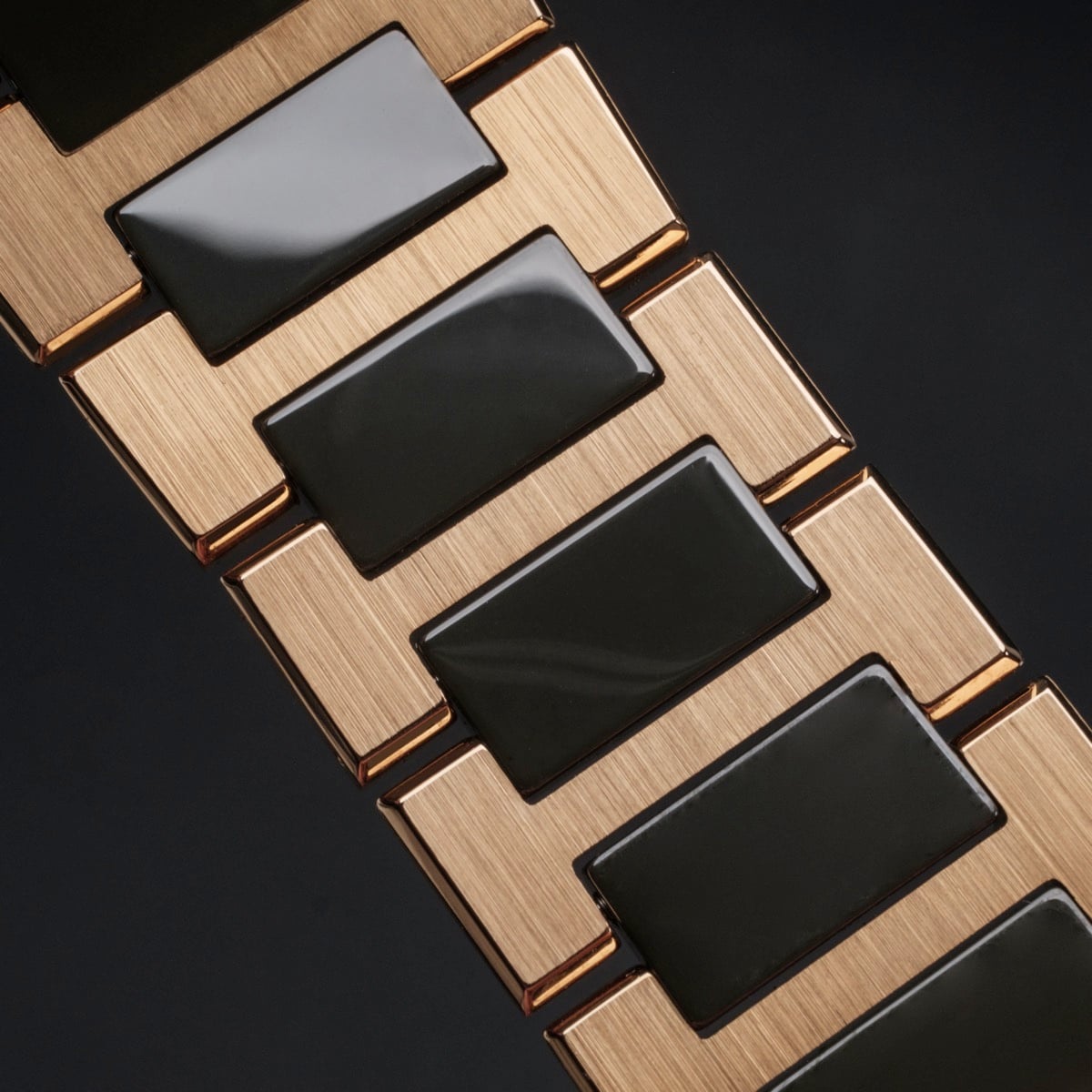 "Oceanswell" watch bracelet featuring a sleek ceramic and gold design with a modern, stylish look.