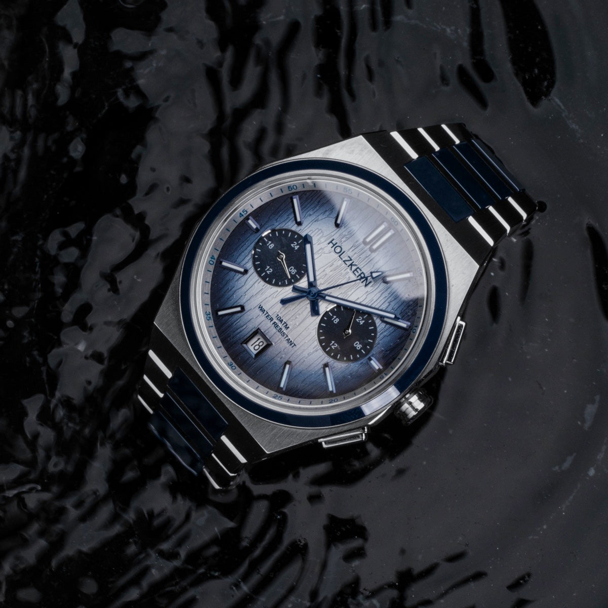 "Oceanswell" watch, ceramic and silver, featuring a sleek oceanic design.