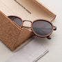 "The Radiant S", stylish sunglasses with a walnut and copper design in an elegant cork case.