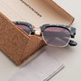"The Virtuoso" sunglasses featuring leadwood and black havana accents in a stylish and unique design.