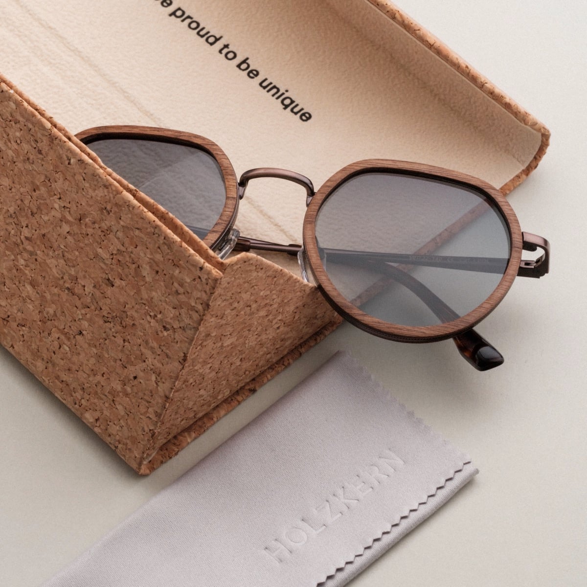 "The Wanderer" sunglasses feature a walnut and bronze design with a unique geometric style.