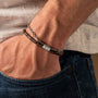 "Supersonic" bracelet in Walnut and silver, featuring a sleek and stylish design on the wrist.