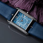 "Memoire" watch featuring a blue agate-style face and elegant design.