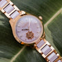 "Kaleidoscopic": A stylish watch with a kaleidoscopic design, featuring amethyst and ceramic accents.