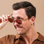 "The Badass II" sunglasses in walnut and matte gold, showcasing a stylish and sophisticated design.