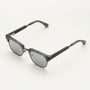"The Virtuoso" sunglasses feature a sleek, modern style with Leadwood and Ash frame accents.