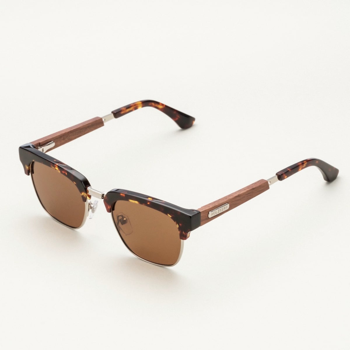 "The Virtuoso" sunglasses feature a stylish walnut and havana design with a sophisticated, modern flair.