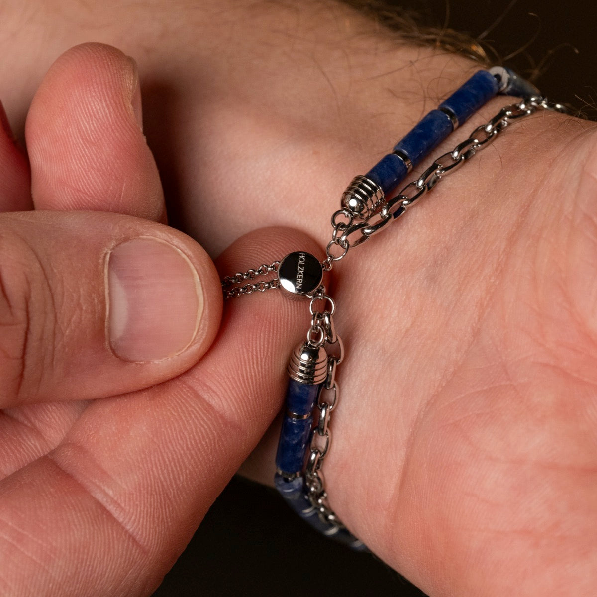 "Supersonic" bracelet featuring a marble and silver chain design on a wrist.