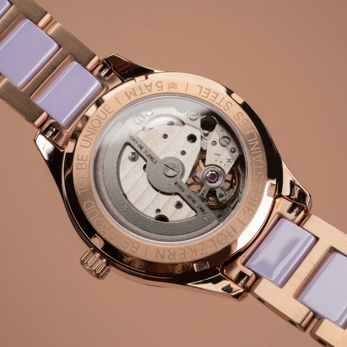 "Kaleidoscopic" watch, showcasing intricate mechanical design and amethyst ceramic accents in a sleek, stylish arrangement.