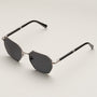 "The Magical" sunglasses featuring a sleek maple finish with antique silver accents and dark lenses.