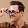 "The Virtuoso" sunglasses featuring a sleek design with Leadwood and Ash materials.