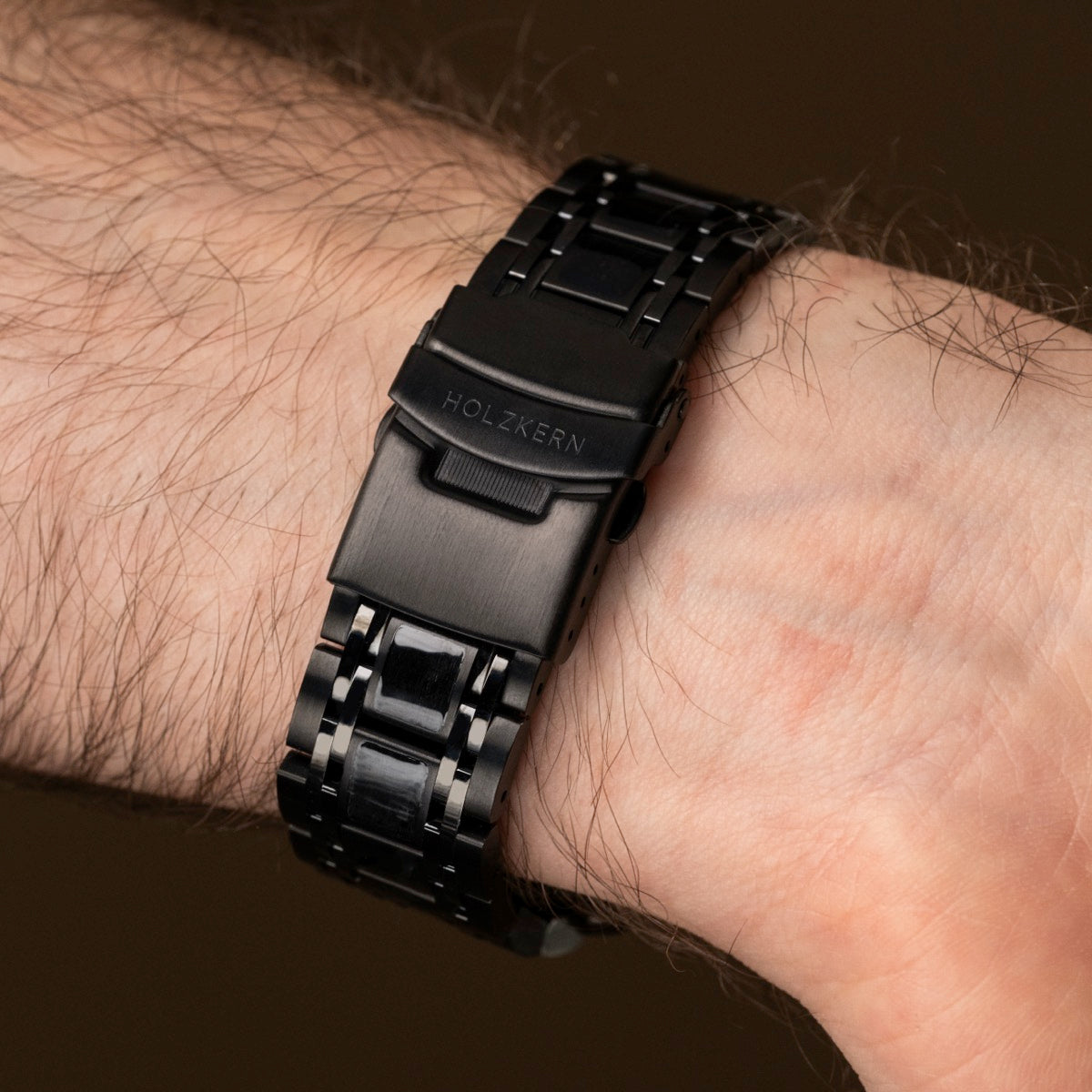 "Genevra, stylish watch with a black metal band and elegant detailing."