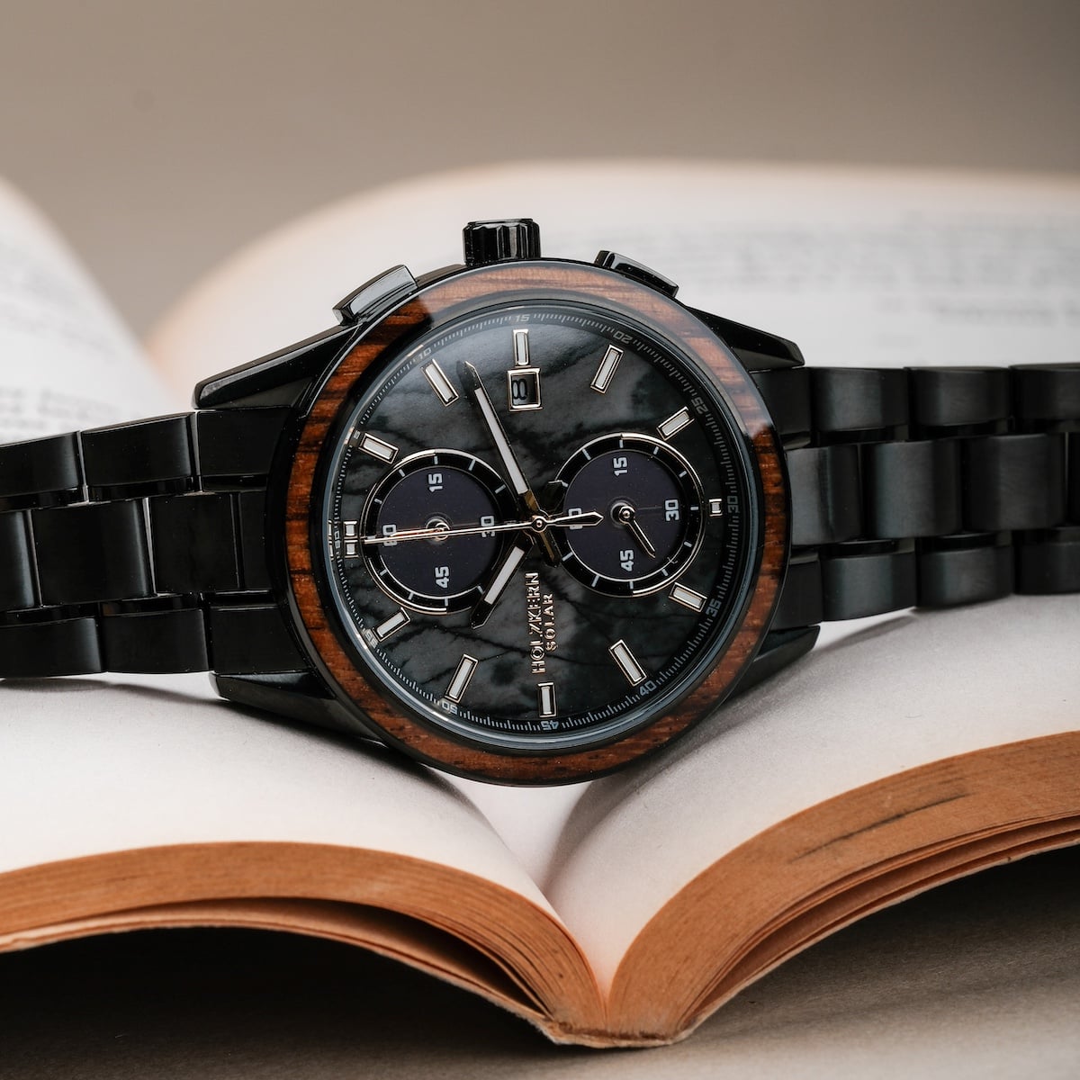 "Endowment" watch featuring a sophisticated marble dial and zebrawood accents, exuding a refined and modern style.