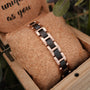 "Acoustic", a stylish bracelet featuring maple and rose gold accents in a unique linked design.