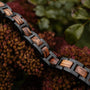 "Acoustic" bracelet crafted from zebrawood and black material, showcasing a natural, stylish contrast.