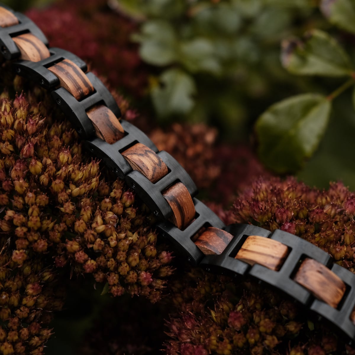 "Acoustic" bracelet crafted from zebrawood and black material, showcasing a natural, stylish contrast.