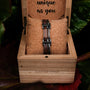 "Staccato" bracelet in walnut and antique silver, showcasing a rustic and elegant style in a wooden box.
