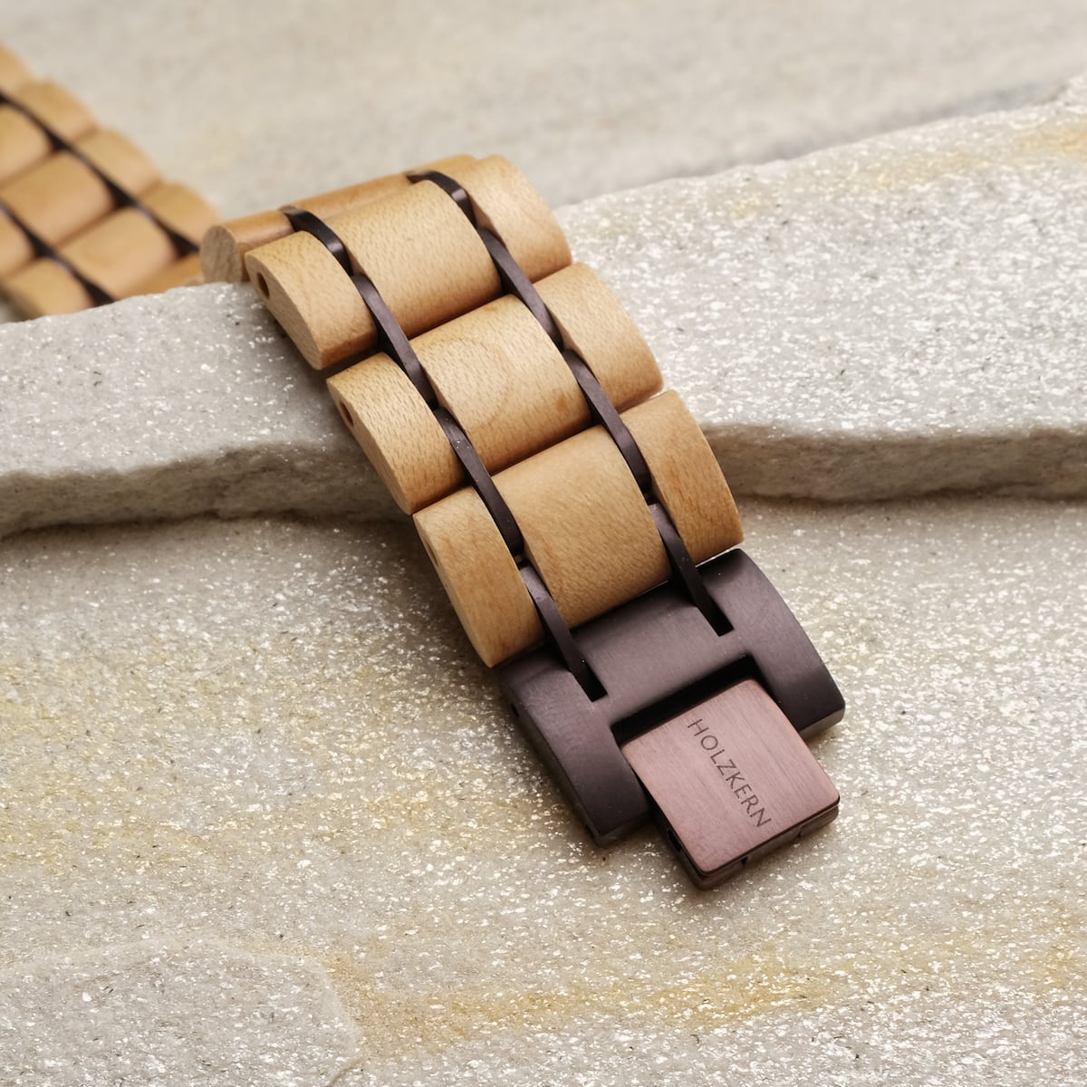 "Grandezza" wooden bracelet, featuring maple and dark purple hues, in a natural, textured style.