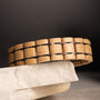 "Grandezza" wooden bracelet in maple and dark purple tones, showcasing a stylish and contemporary design.